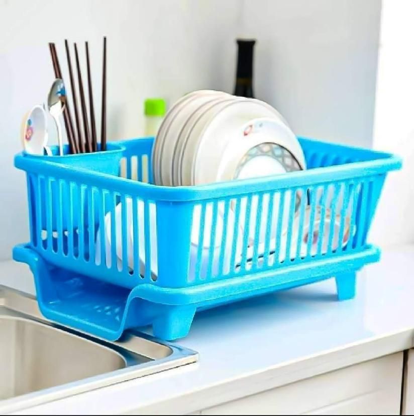 Blue dish rack with dishes on a kitchen counter